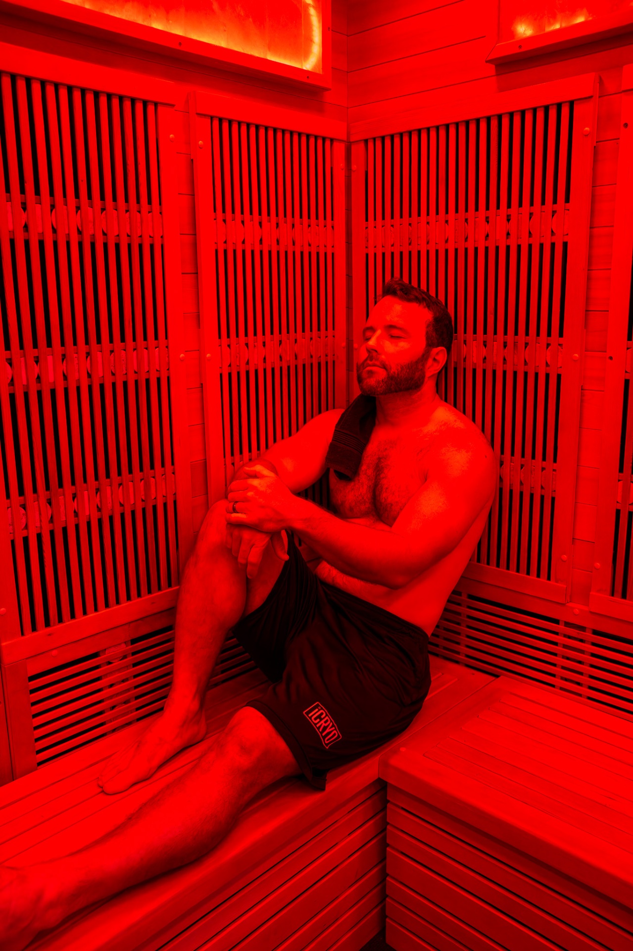 Guest relaxing inside a full-spectrum infrared sauna at iCRYO Marietta